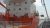 A large industrial ship with a white structure and red deck.