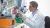 Scientist looking through a microscope